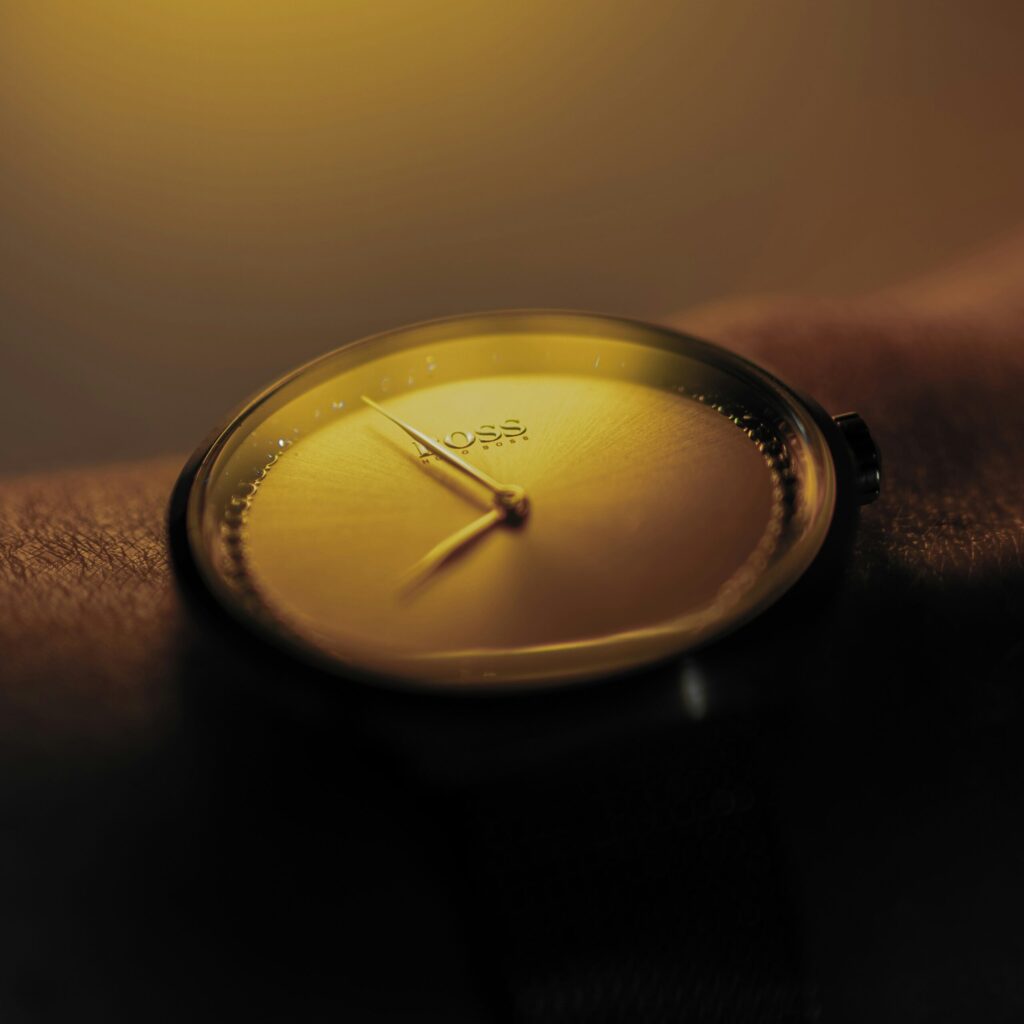 close-up of a golden minimalist watch on a wrist